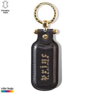 PRIVEZAK OD KOŽE PRAVOUGAONI 5 Crni kožni privezak sa zlatnim prstenom i natpisom "Princ Leather".